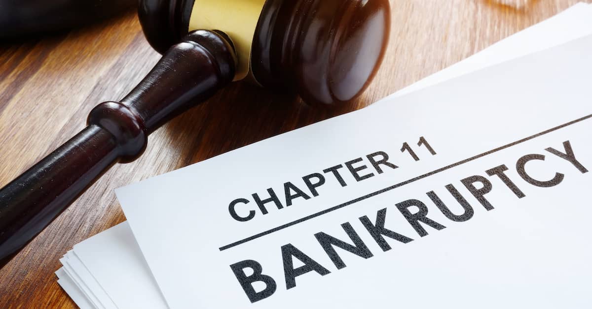 bankruptcy paperwork sits on a lawyers desk | Colling Gilbert Wright